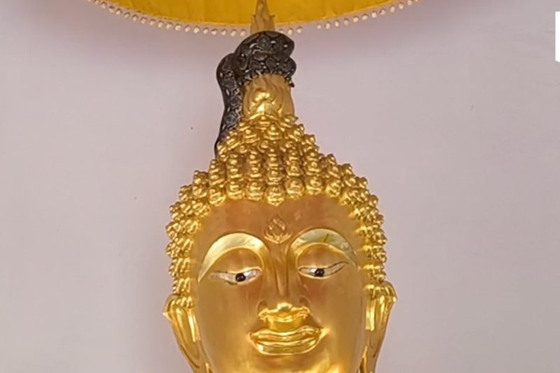 Python found coiled around Buddha statue in Nakhon Nayok